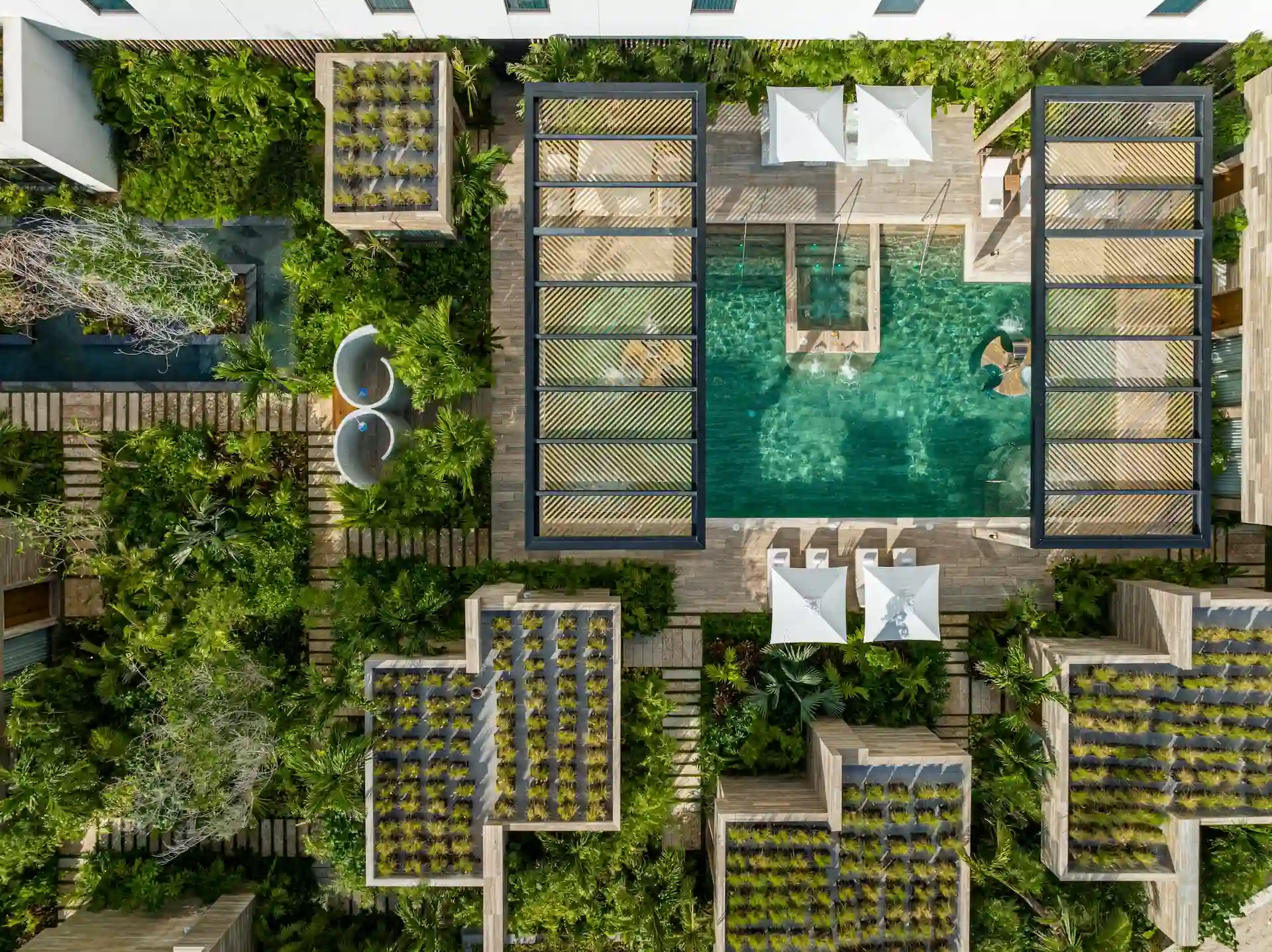 An overhead view of the spa, completely surrounded by lush vegetation, creating a peaceful and natural retreat.